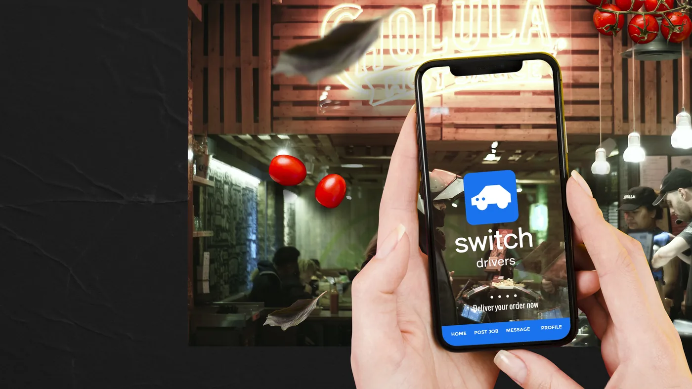 Switch Drivers app open on a phone held in a restaurant